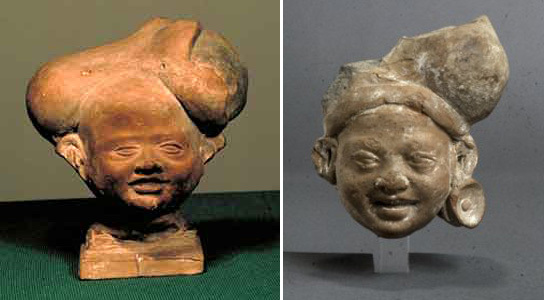Terracotta Smiling Children Heads [Object]