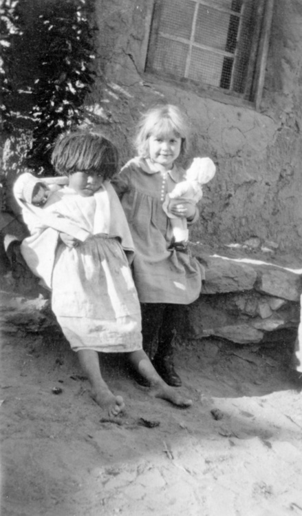 American Indian Girls Playing with Dolls [Photograph]